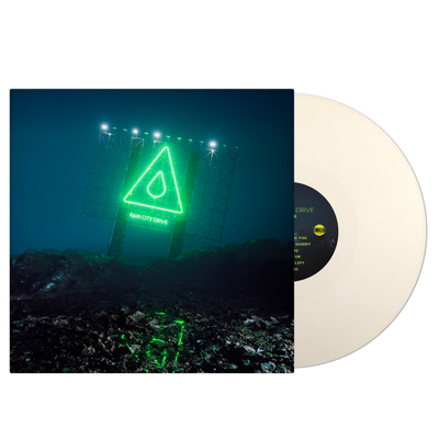 Image of the Rain city drive self titled album as a vinyl sleeve and vinyl against a transparent background. The vinyl, a bone white color, is sticking halfway out of the vinyl sleeve. The vinyl sleeve features an image of  a neon green sign lit up at night, that says rain city drive. Above that is an image of a triangle with a raindrop in the center of it.  The ground surrounding the sign is rocky.