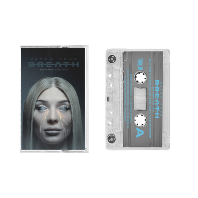 A limited edition Catch Your Breath cassette and clear plastic case are displayed side by side. The case has surreal cover art showing a woman with glowing eyes and lines extending from them.