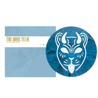 A limited edition opaque cyan vinyl by The Home Team features a white stylized cat face, comes with a matching blue "Live at Abbey Road" cover, and includes a color printed inner sleeve.