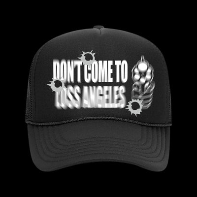Image of a black hat against a transparent background. The hat says Don't come to loss angeles in white blurred text. There are blurred white circular graphics with points on them around the hat.