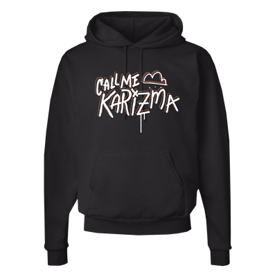 Image of a black hoodie against a transparent background. The hoodie says call me karizma in white text with an orange outline. There is a white cloud with orange outline next to the words call me. the Z in karizma is dripping white paint.