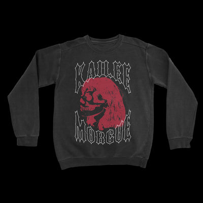 Photo of a black crewneck sweatshirt against a transparent background. In white outline text reads "kailee morgue". In between the words Kailee and Morgue is an image of a red side profile of a skull with hair.