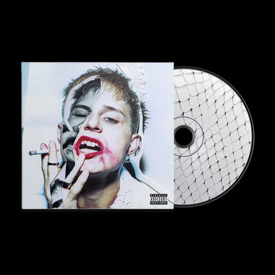 Image of a cd sleeve with a cd sticking out of the sleeve. The cd sleeve features a photo of a person wearing red lipstick- their mouth is open and they have lipstick smeared on their face. They are holding a cigarette up close to their mouth. One half of their face is in black and white, the other is in color.